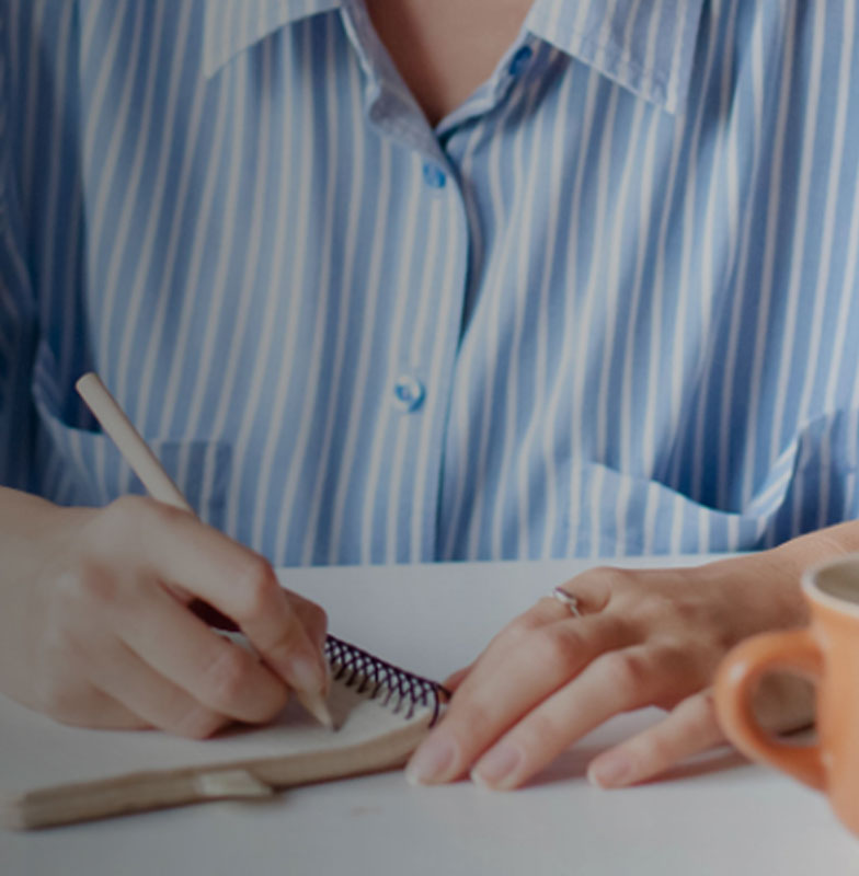 Man Writing on a Book